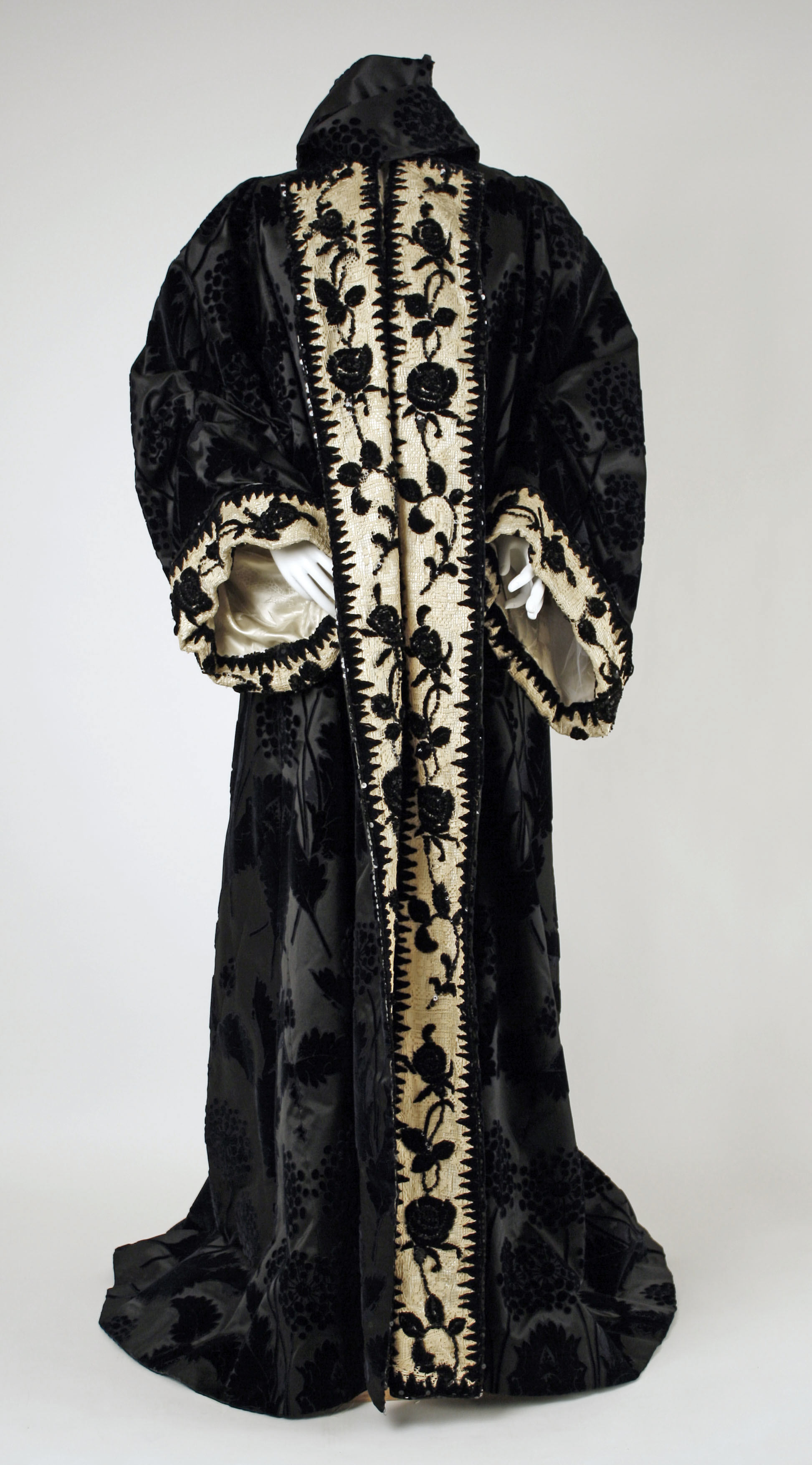 House of Worth silk coat from 1898, photographed frontally against a neutral background.