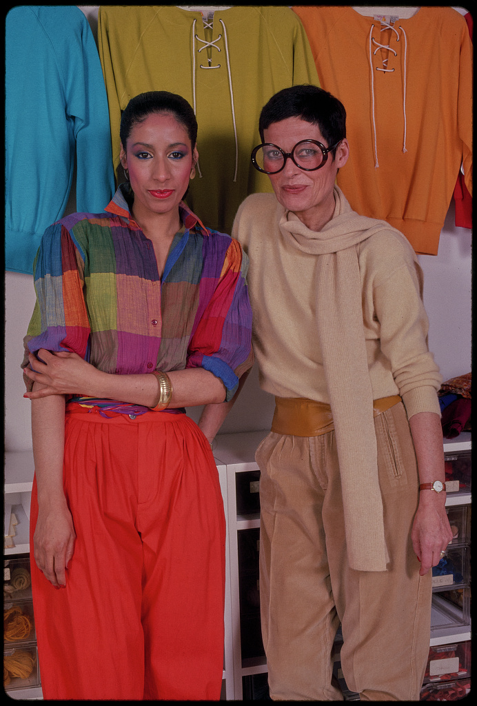 Fashion designer Liz Claiborne standing beside a model in a Library of Congress photograph by Bernard Gotfryd.